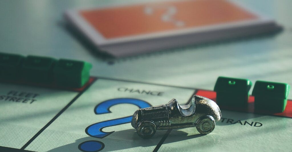 A close-up of a Monopoly board game featuring a silver car token and chance card.